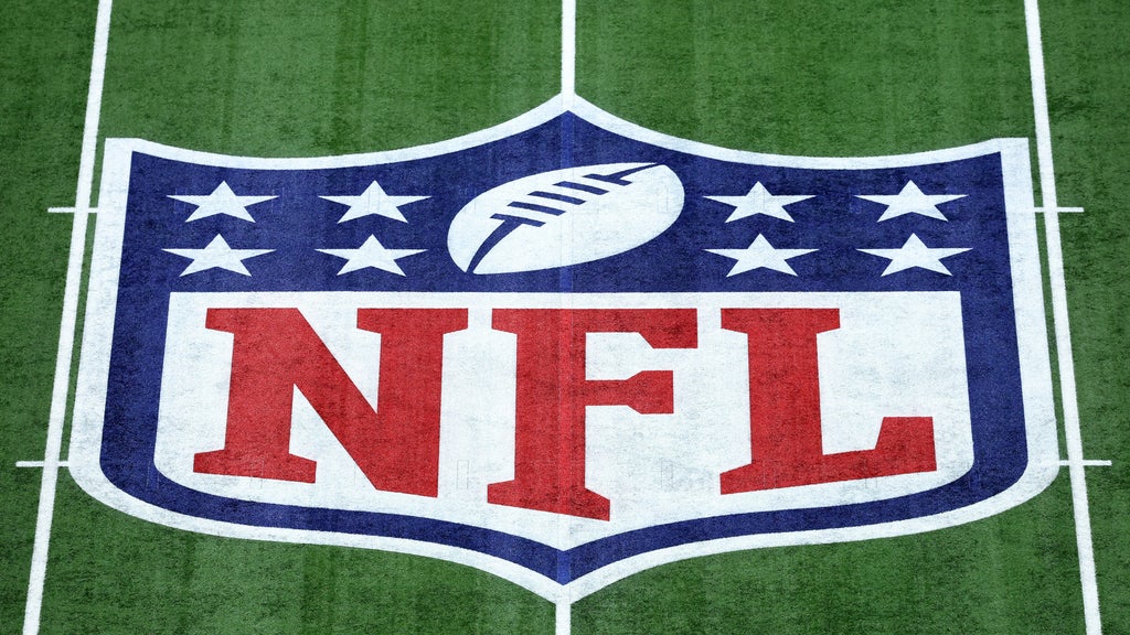 Former NFL player in silhouette, head bowed, contemplating the long-term health impacts of football
